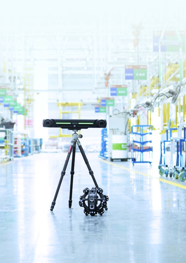 Scantech NimbleTrack 3D Wireless Scanner sitting on the floor of a production line in a warehouse